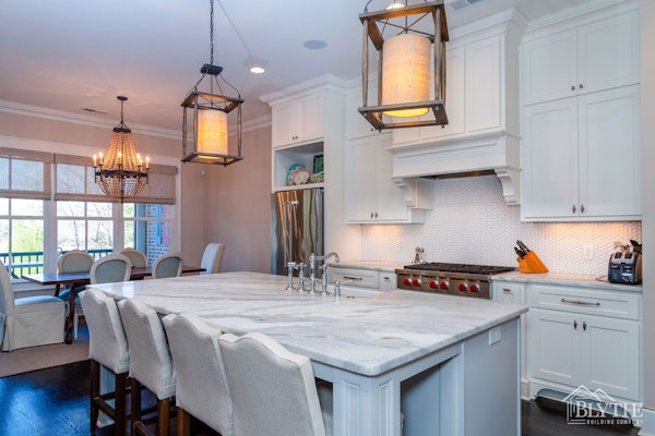 Marble Countertop Kitchen Island with rustic oversized pendant lights