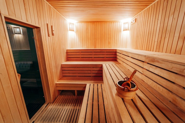 A wood paneled sauna in a spa.