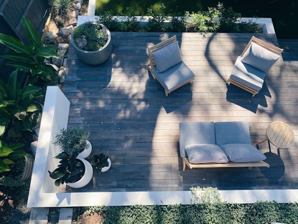 overhead shot of a deck with furniture and planters