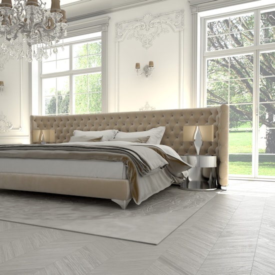 Luxurious Italian-made bedroom suite in lavish master bedroom with floor-to-ceiling windows.