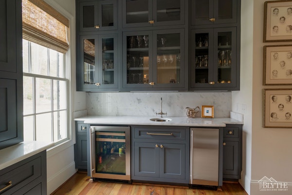 Formal butler's pantry with wet bar and wine cooler