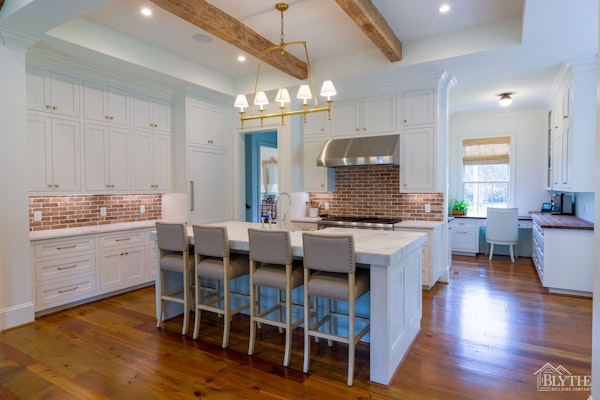 Custom Kitchen With Thin Brick Backsplash White Cabinets Eat In Island Wood Ceiling Beams And Hardwood Floors