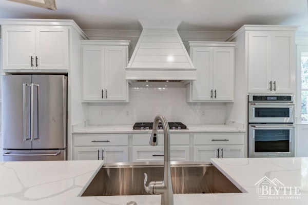 Shiplap Range Hood Cover in white kitchen - (home builder sc)