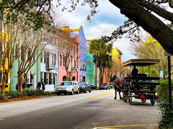 Rainbow Row in Charleston, SC wtih horse-drawn carriage