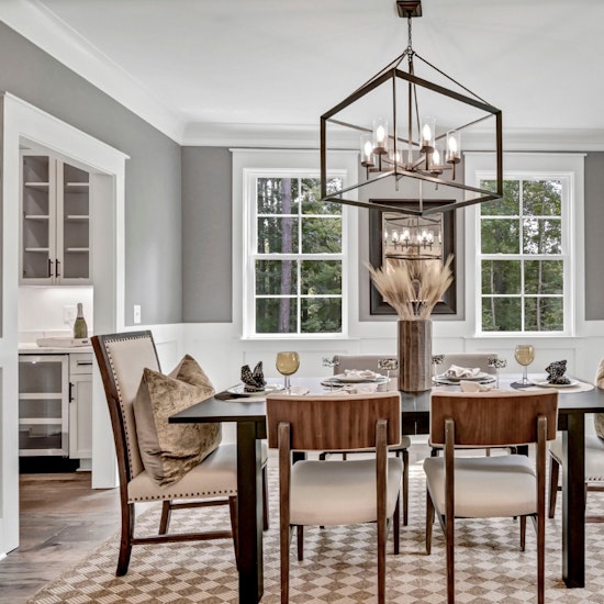 Modern Craftsman Formal Dining Room With White Wainscoting Gray Walls And Oversized Pendant Light