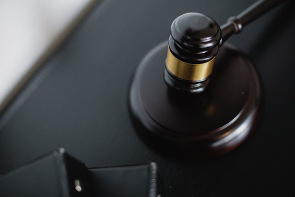 Judge's gavel on a wooden desk