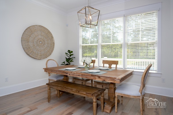 farmhouse-chic-dining-room-hardwood-floors-large-pendant-light.jpg