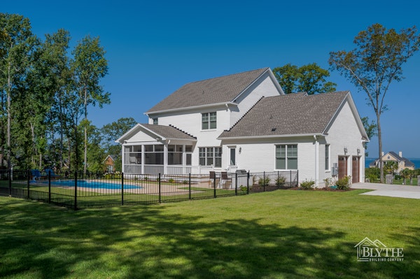 Rear exterior of a Craftsman Farmhouse on Lake Murray with in-ground pool