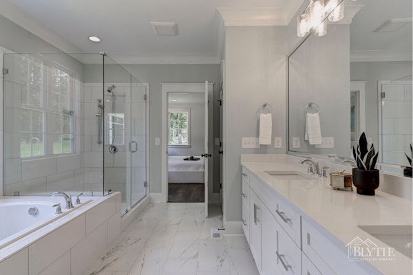 Luxury Master Bathroom With Dual Vanity Custom Cabinets Drop In Tub And Extra Large Shower With Glass Enclosure