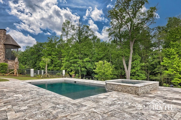 Custom In Ground Pool And Spa With Natural Stone Paver Pool Decking Overlooking The Woods  4