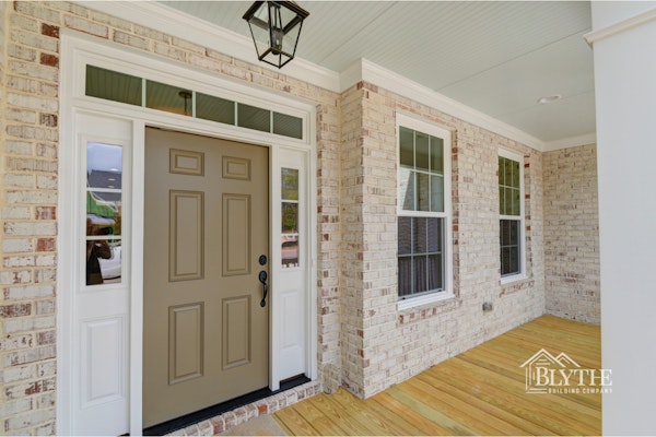 Craftsman Home With Welcoming Front Door And Transom Window - Limewashed brick