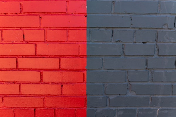 Red painted brick wall and dark gray painted brick wall