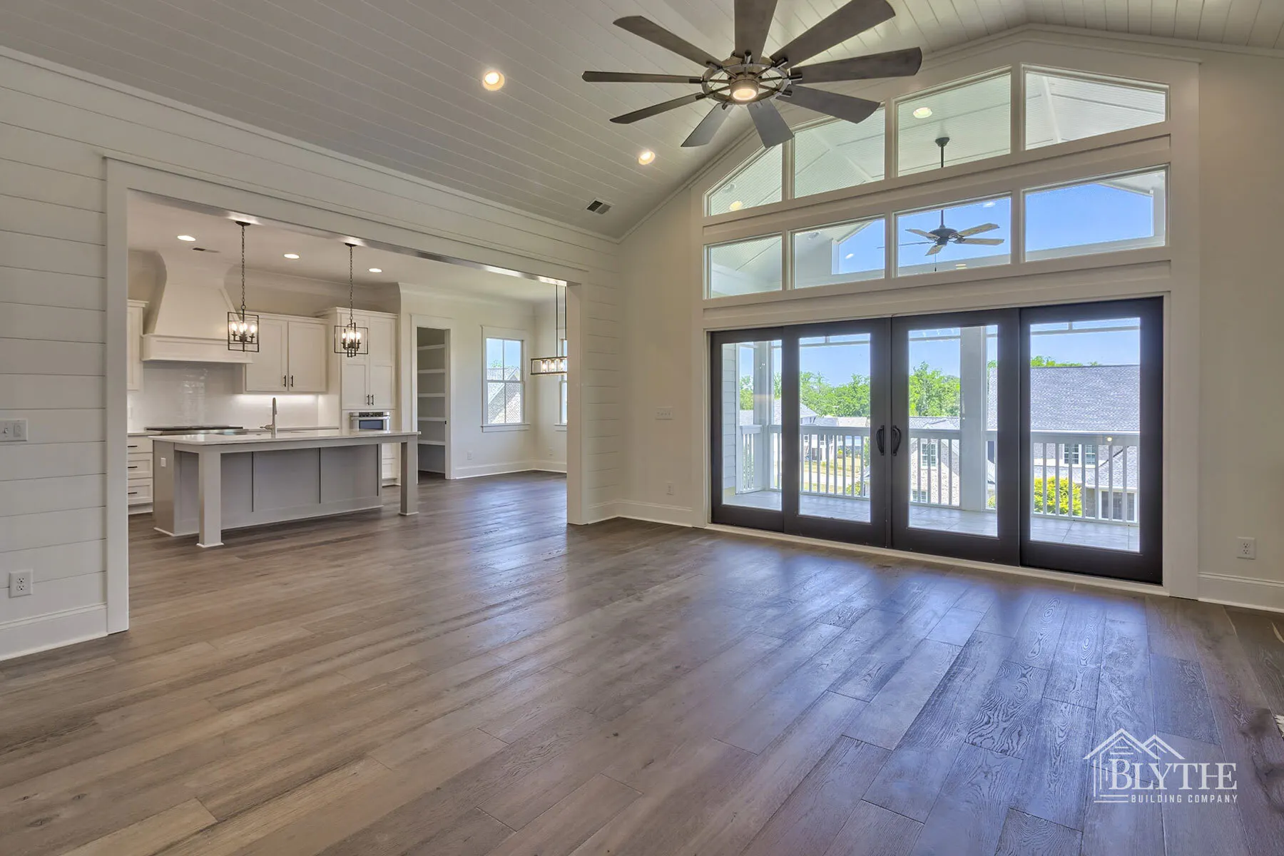 Living Room with shiplap ceiling and walls and Hard Wood Flooring 1 2